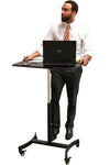 Victor DC500 Hick Rise Mobile adjustable desk cart being used by a person with a computer, calculator and notepad on top of the desk.