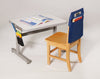 Black Hand-e-Sack hanging from side of desk with school supplies