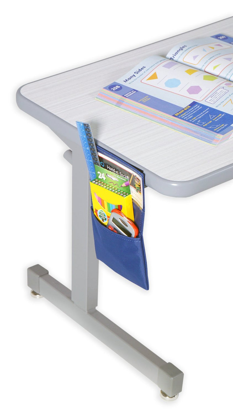 Blue Hand-e-Sack hanging from side of desk with school supplies.