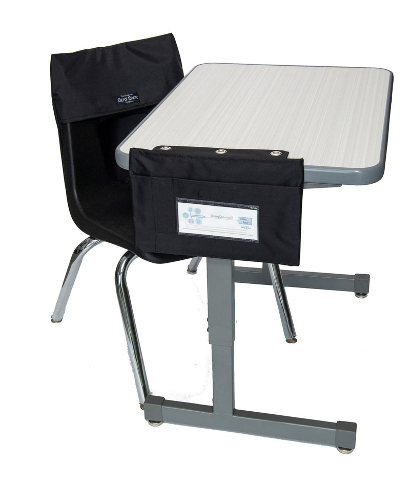 Black Large Tablet Taker hanging from the side of a desk to hold to hold a chromebook and tech accessories at students seat, tablet taker